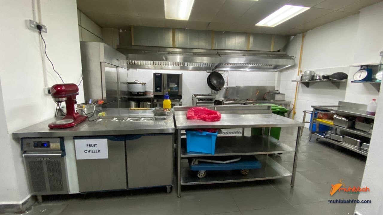 Preparation counter, labelled fruit chiller, combi oven and extraction canopy at the Muhibbah F&B central kitchen in Ampang, Selangor