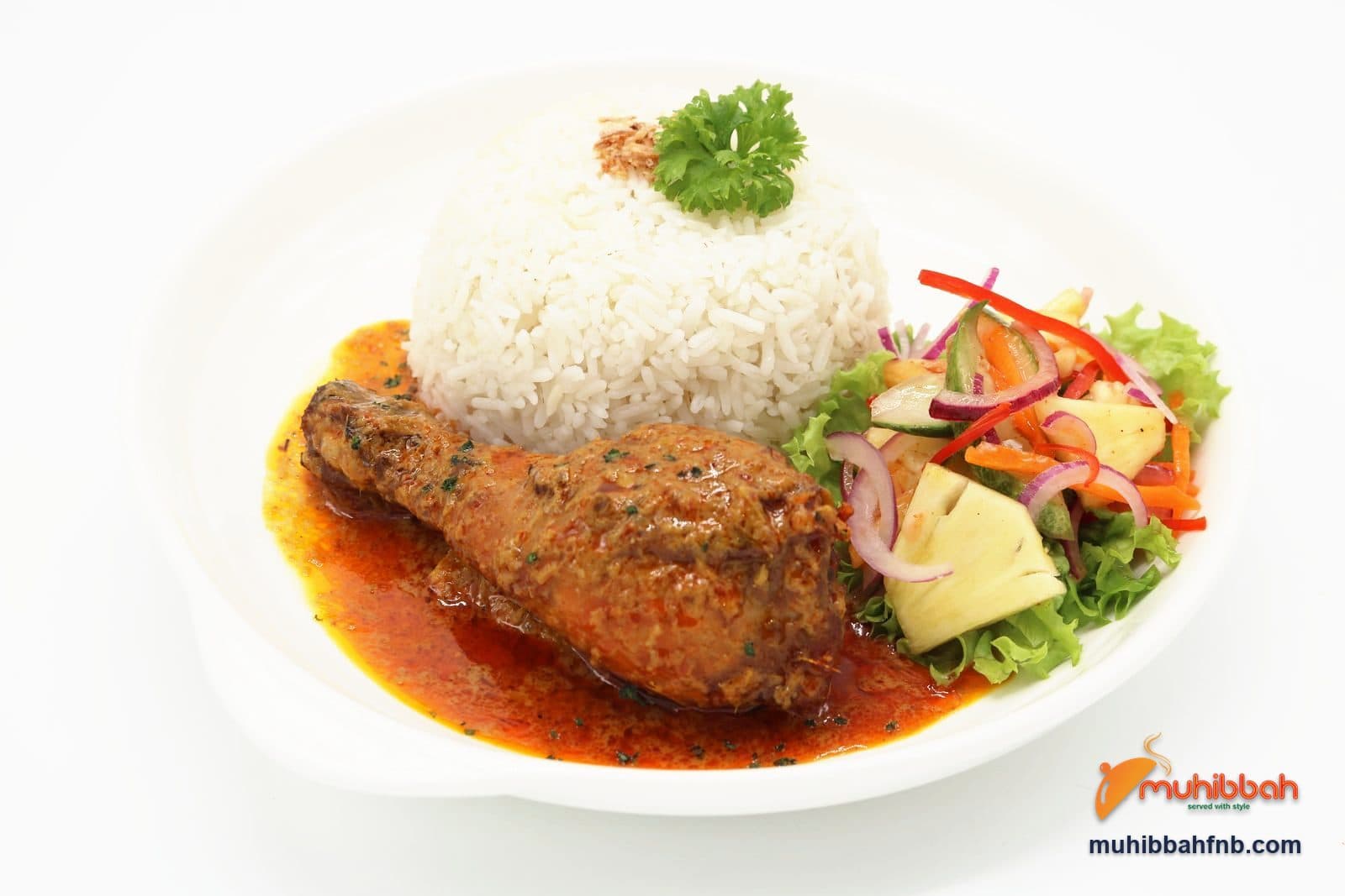 Ayam percik chicken in spiced coconut gravy with rice and salad