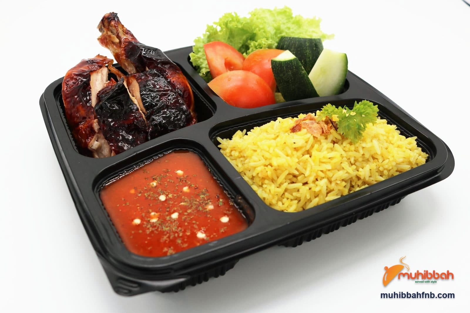 Bento box with roast chicken, rice, salad and chilli sauce