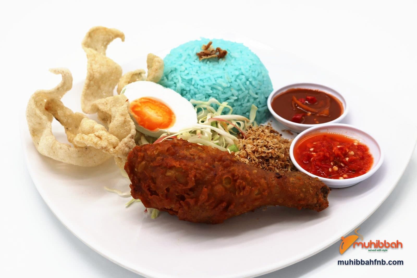 Nasi kerabu with blue rice, fried chicken, salted egg and sambal