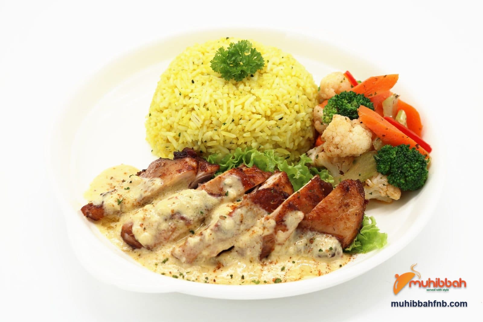 Roast chicken in cream sauce with turmeric rice and buttered vegetables