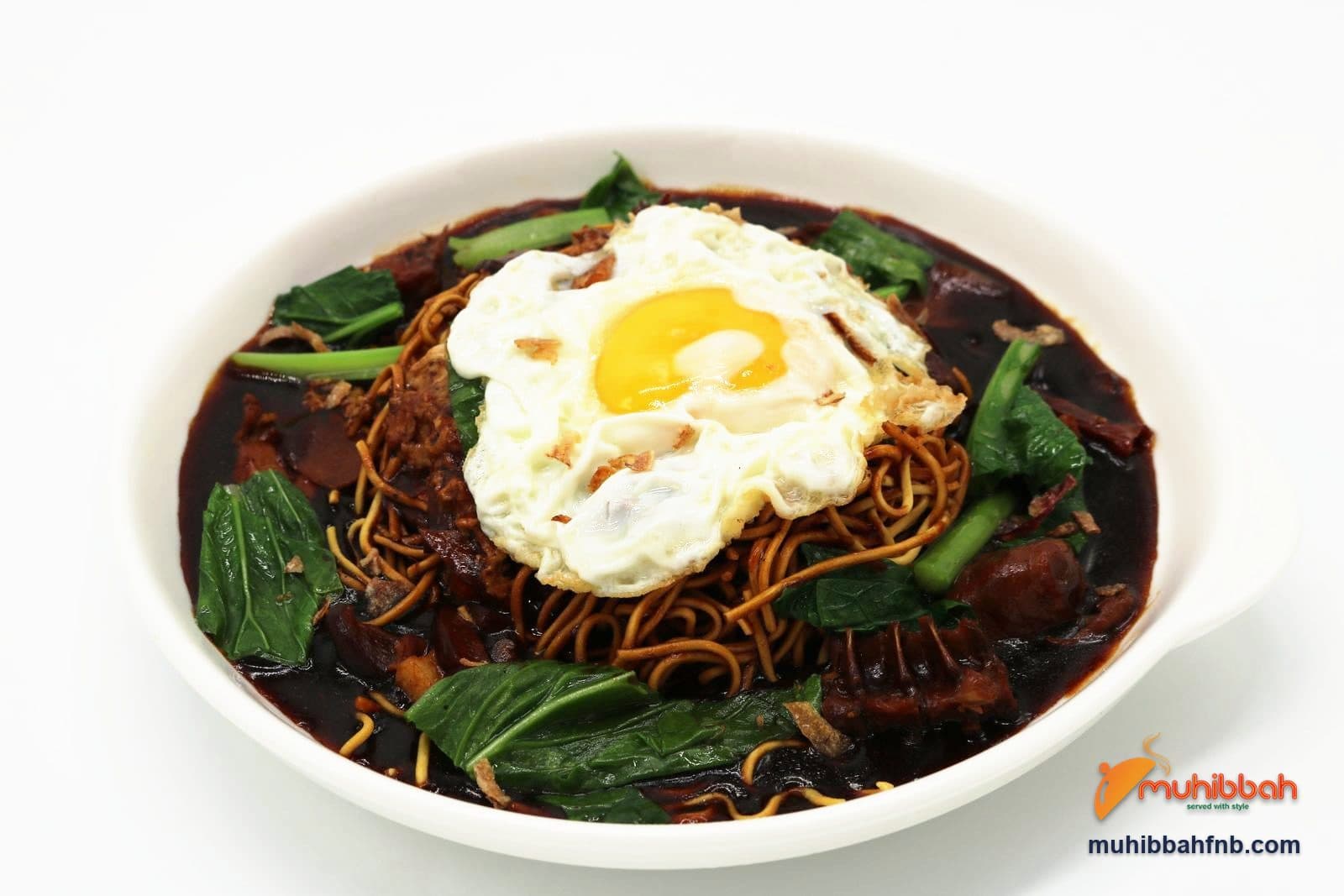 Braised yee mee noodles with a fried egg and mustard greens
